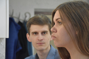 Defocused man looking at beautiful wife