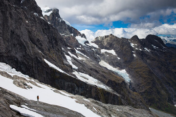 Climber descending beside the Cleft, Cleft Creek, Darran Mountains, Fiordland National Park