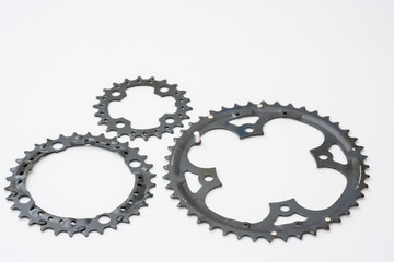 Gears, sprockets and chain of a mountain sports bike on a white background. Bicycle parts
