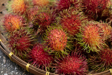 organic fresh rambutan peeled ready to eat on bamboo basketry tray