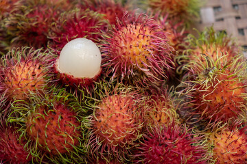 organic fresh rambutan peeled ready to eat on bamboo basketry tray