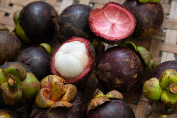 organic fresh mangosteen peeled ready to eat place on bamboo basketry tray