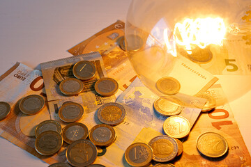 Cost of living concept. Money and light