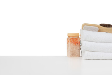 White towels and spa skincare cosmetics on white background
