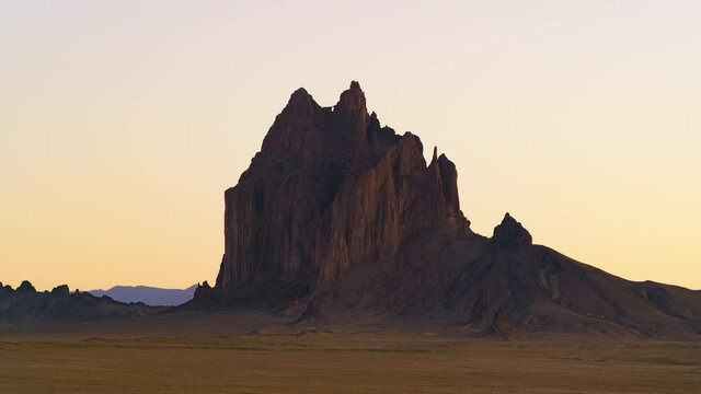 Time lapse of massive rocks at sunset in Shiprock in New Mexico