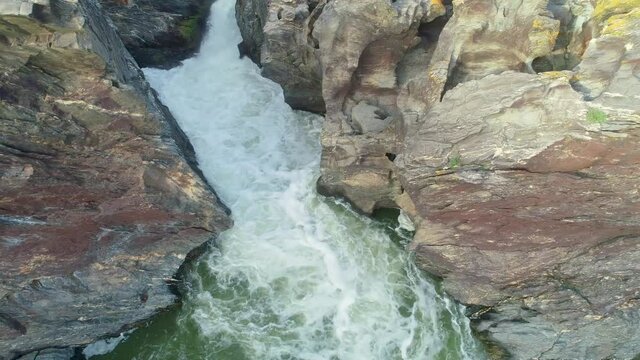 Aerial view of a wild river with waterfall in southeastern Portugal