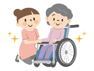 笑顔の車椅子に乗ったシニア女性と寄り添う女性