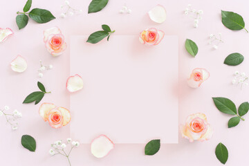 Fototapeta na wymiar Pastel delicate background with pink roses and petals. Top view