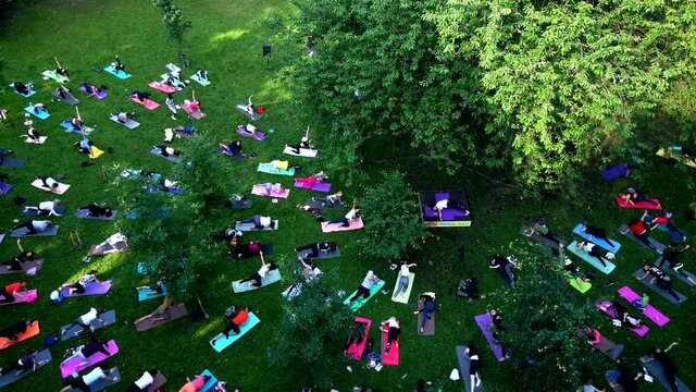 people do yoga at city public park