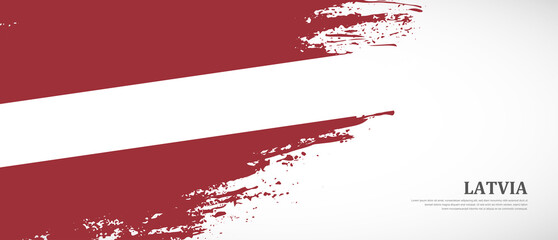 National flag of Latvia with textured brush flag. Artistic hand drawn brush flag banner background