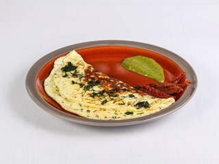 Omelet for breakfast served parsley