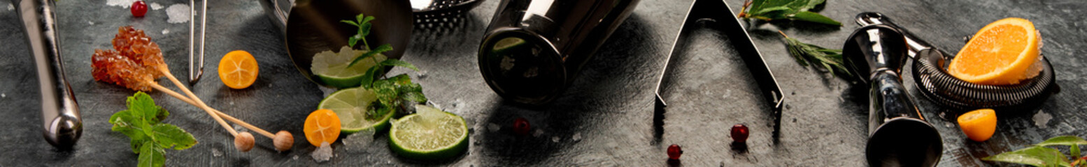 Cocktail bar equipment on dark background.