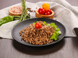 Vegetarian superfood – boiled buckwheat in the plate
