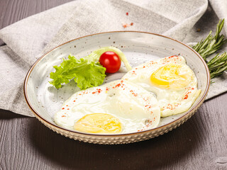 Two fried eggs in the plate