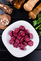 Tasty beetroot ravioli, Beetroot ravioli stuffed with baked beets and meat. Vegetarian food. Colored dumplings in a white plate