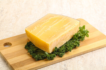 Parmesan cheese piece over board