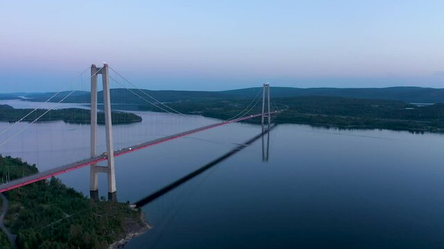H&ouml;ga kusten bridge in Sweden, aerial flying footage of the famous bridge at sunset
