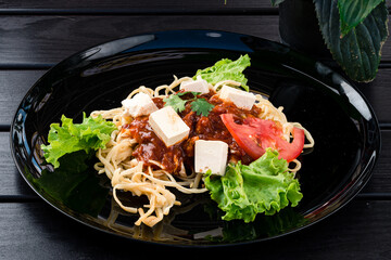 Vegetarian or vegan Indian food with noodles and tofu