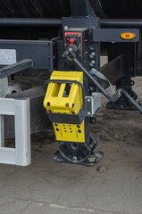 Yellow wheel support fixed to the truck bed. Supports for semi-t