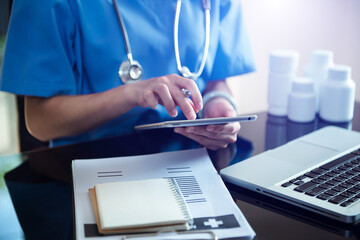 Medicine doctor hand working with modern digital tablet computer interface as medical network