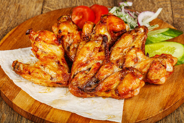 Chicken wings barbeque vith vegetables