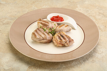 Grilled pork tenderlion with tomato sauce