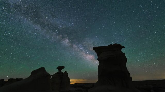 Time lapse pan of Milky Way galaxy over hoodoos at Valley of Dreams in Bisti Wilderness in New Mexico