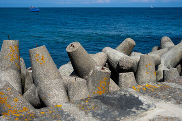 Concrete breakwater at the entrance to the port. Photo taken in the afternoon with good lighting conditions.