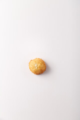 Toasted coconut cake on white background. Top view, flatlay. Nobody. Soft lighting.nobody