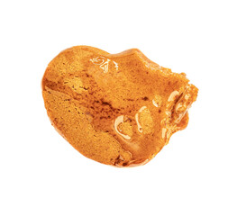Gingerbread piece of cookie with caramel sauce for Christmas. Gingerbread men Isolated on white background. Xmas food, symbol  concept