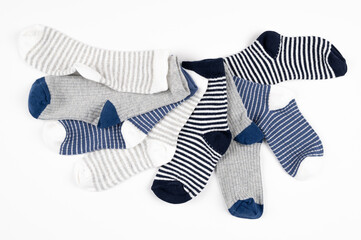 Cute little baby boy socks isolated on white.