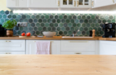 blurred kitchen interior and wooden desk space home background