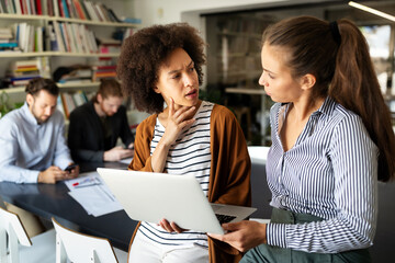 Collaboration and analysis by business people working in office