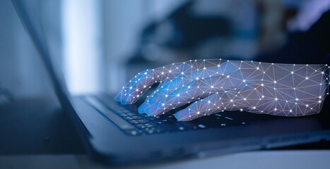 close up on robot hand working on laptop to checking correct data by using RPA function software...