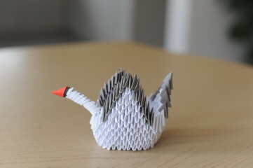 3D modular origami paper swan handmade with white paper – an example of craftwork and handwork...