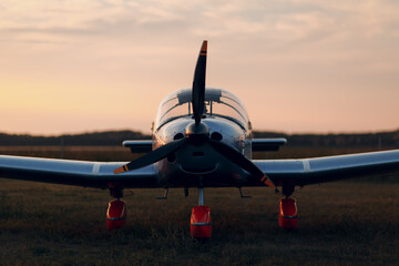 RUSSIA, MOSCOW - AUGUST 1, 2020: Small private single engine propeller airplane at sunset regional airport. © primipil