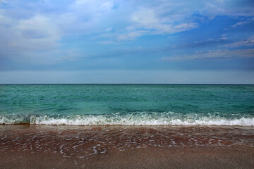 Seashore in calm cloudy weather.
