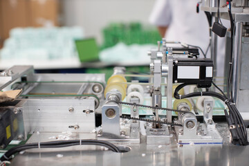 Industry and factory concept, medical face mask production line.