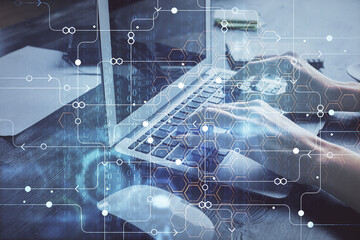 Double exposure of woman hands working on computer and data theme hologram drawing. Tech concept.