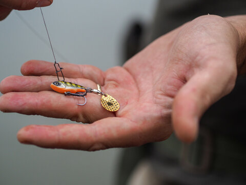 Fisherman holding a fishing tackle
