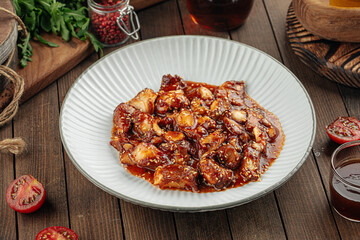 Asian chicken with sweet sauce and sesame seeds dish