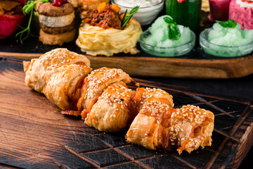 Pizza Calzone folded as a patty on a wooden board table