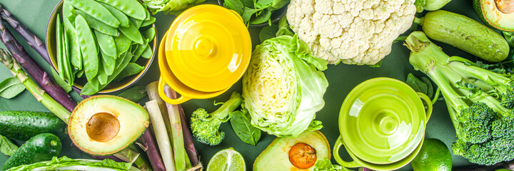 Green vegetables with cooking pots