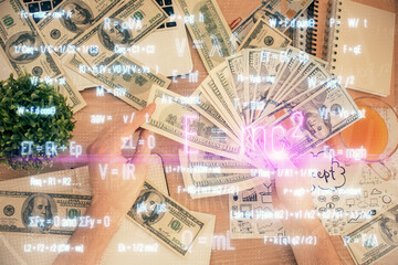 Multi exposure of Formulas drawing hologram and USA dollars bills and man hands. Education