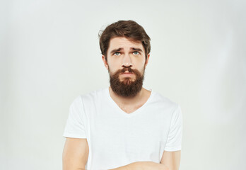 Obraz premium Man in a white t-shirt expressive look discontent Lifestyle