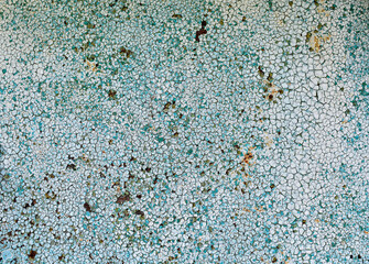 Cracked paint on a metal surface. Background.