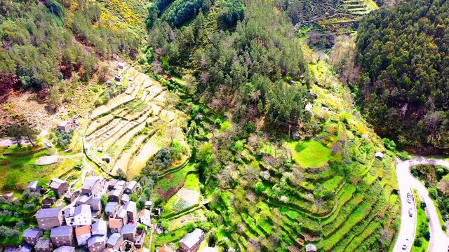 Aerial Forward Scenic View Of Famous Village Over Hills On Sunny Day - Piodao, Portugal