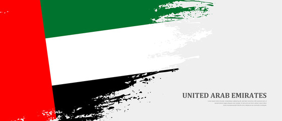 National flag of United Arab Emirates with textured brush flag. Artistic hand drawn brush flag banner background