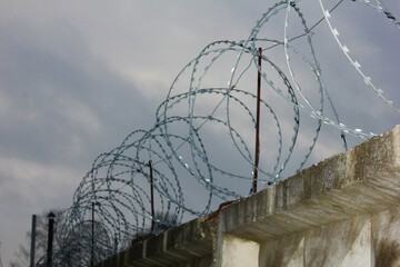 barbed wire against the sky