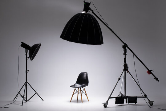 Photo studio with lighting equipment. light scheme and chair. The concept of selection and casting. Job recruitment advertisement.